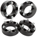 A set of four black wheel spacers with nuts and bolts, designed for use with Toyota vehicles.