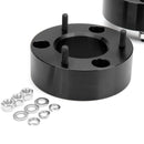Black lift kit with screws and washers on a white background